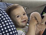 in the car with her monkey